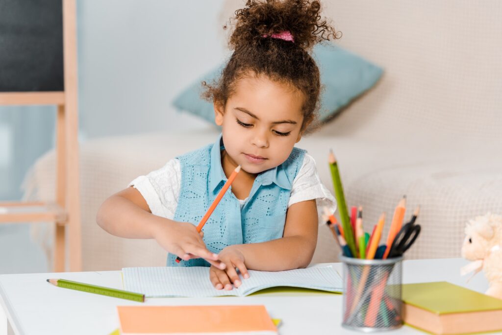 beautiful african american child studying in conseb